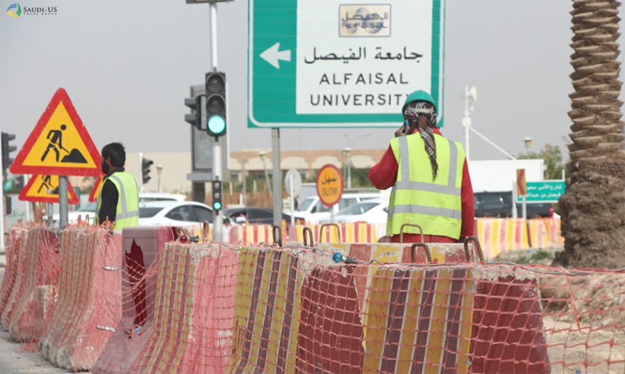 A construction worker in Saudi Arabia speaks on his mobile phone at a construction site in Riyadh.
