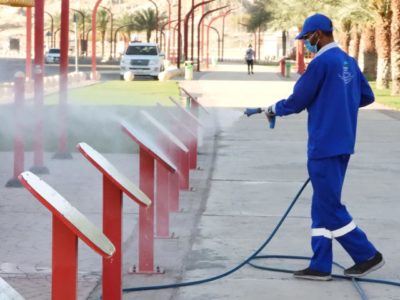 A worker cleanses an area to prevent the spread of COVID-19. 