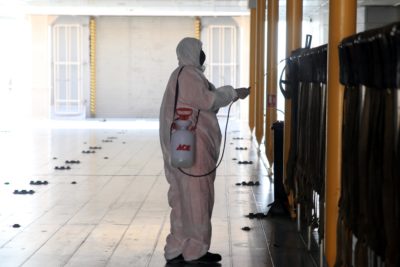 A worker sanitizes an area in Saudi Arabia to stop the spread of COVID-19.