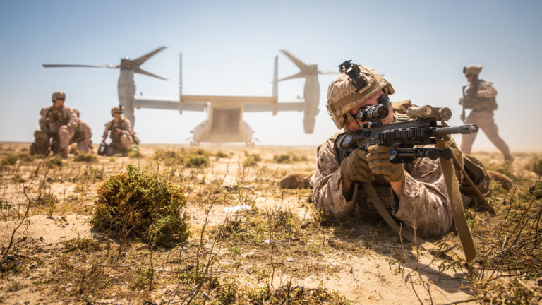 A U.S. Marine assigned to the Special Purpose Marine Air-Ground Task Force-Crisis Response-Central Command (SPMAGTF-CR-CC) 19.2, posts security during a tactical recovery of aircraft and personnel (TRAP) exercise on Karan Island, Kingdom of Saudi Arabia, April 23, 2020. The exercise affords the SPMAGTF an opportunity to sustain its critical mission capabilities, demonstrate its ability to rapidly respond to emergent threats and crises, and improve its ability to project power in the maritime domain. (U.S. Marine Corps photo by Sgt. Kyle C. Talbot)