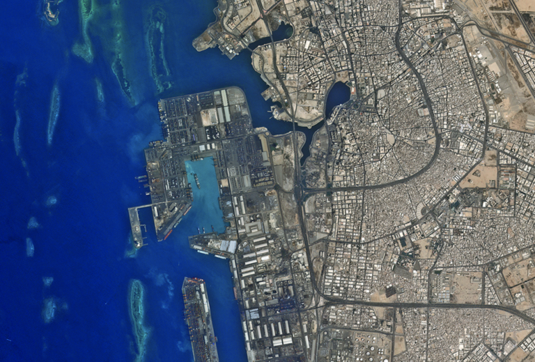 Reefs shown on the left protecting Jeddah's port. Photo taken by the NASA Earth Observatory.