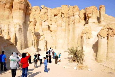 Tourists in Saudi Arabia visit an ancient site.