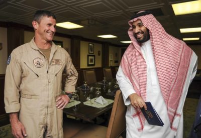 Crown Prince Mohammed bin Salman laughs while speaking with Rear Adm. Andrew Lewis, commander of Carrier Strike Group (CSG) 12, aboard the aircraft carrier USS Theodore Roosevelt (CVN 71) in 2015. Photo via DOD.