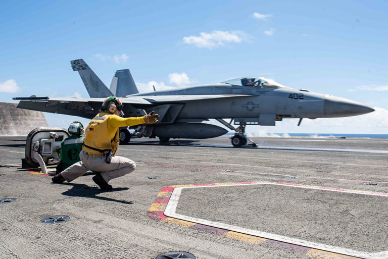 The launch an F/A-18E Super Hornet from Strike Fighter Squadron (VFA) 195 from the flight deck aboard the Navy’s forward-deployed aircraft carrier USS Ronald Reagan (CVN 76). Photo via DOD.