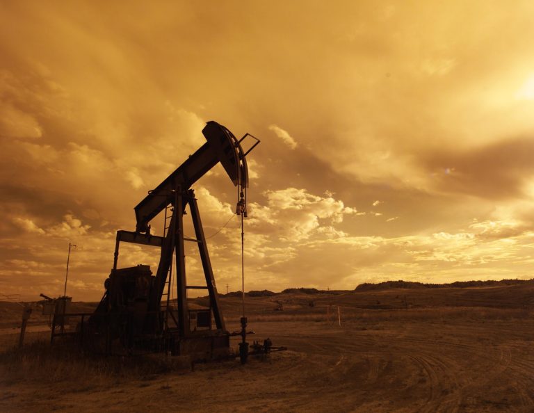 A pump jack is silhouetted against the sunset at Naval Petroleum Reserve No.3 (NPR-3) near Casper, Wyoming.