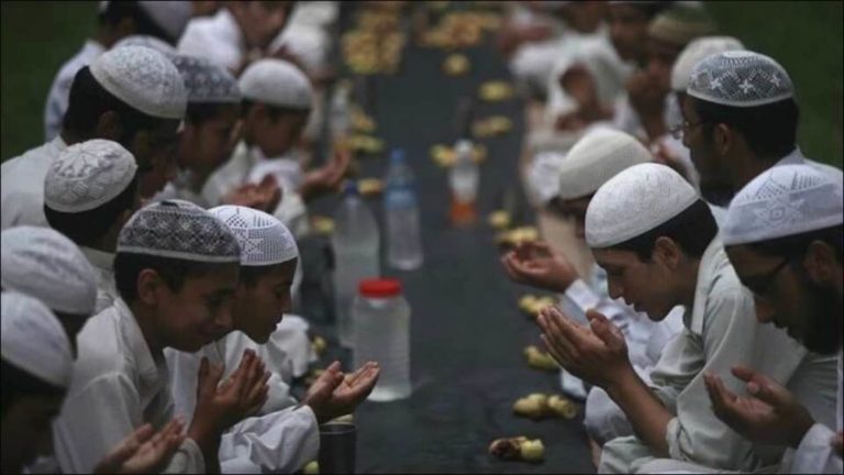 Muslims, breaking fast